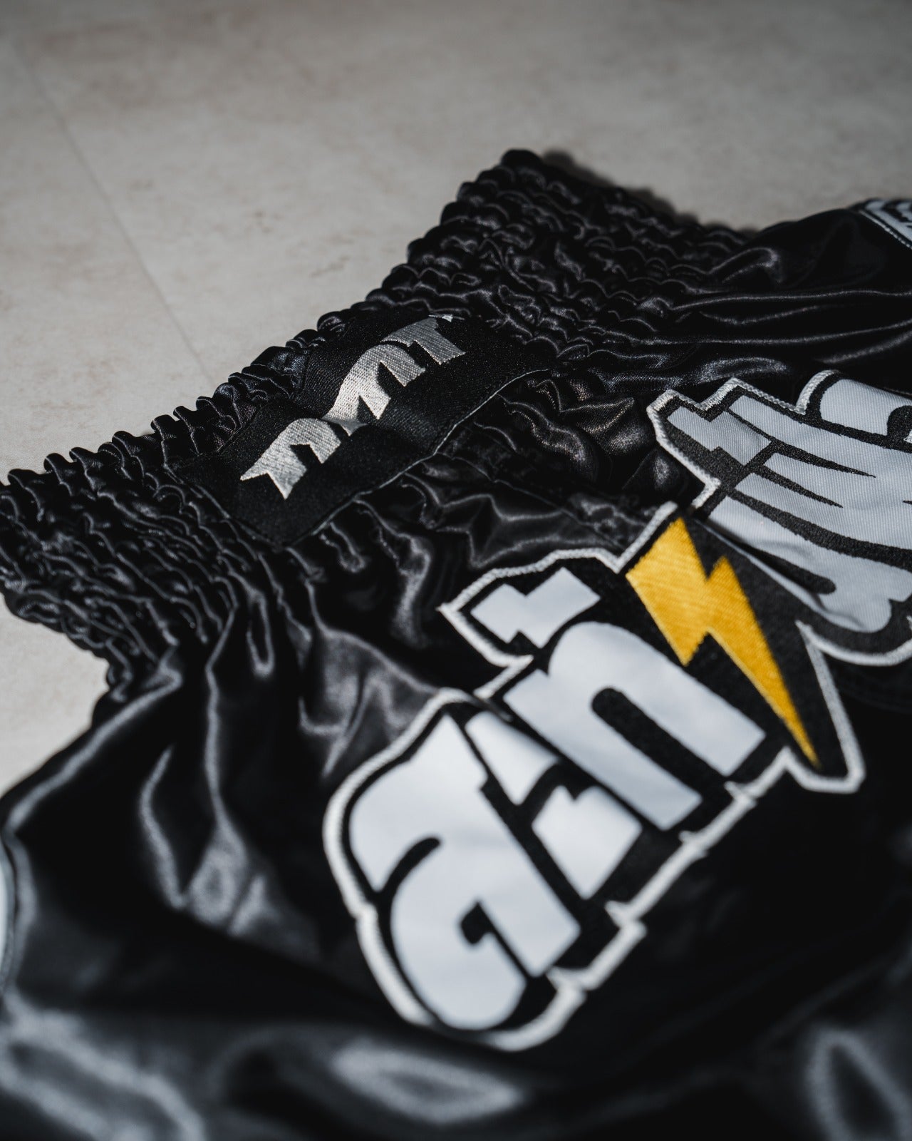 NMT 'Shake The Sky' Muay Thai Shorts - Shadow Black